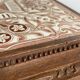 Vintage wooden and antique earthenware trivet, brown tile design