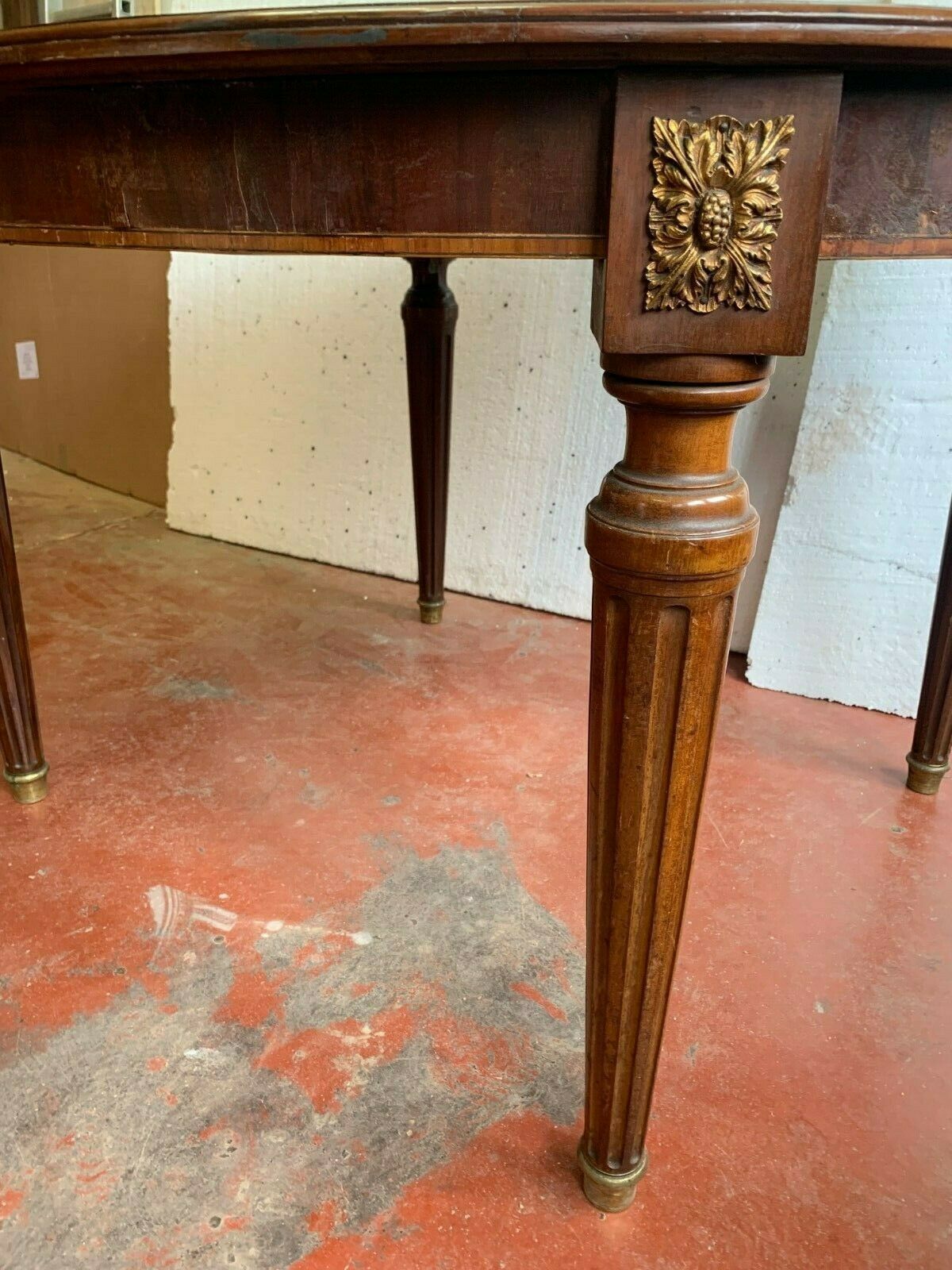 Louis XVI style table in mahogany and light wood 20th century