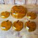 Salad bowl and apple raviers in amber glass 70 years