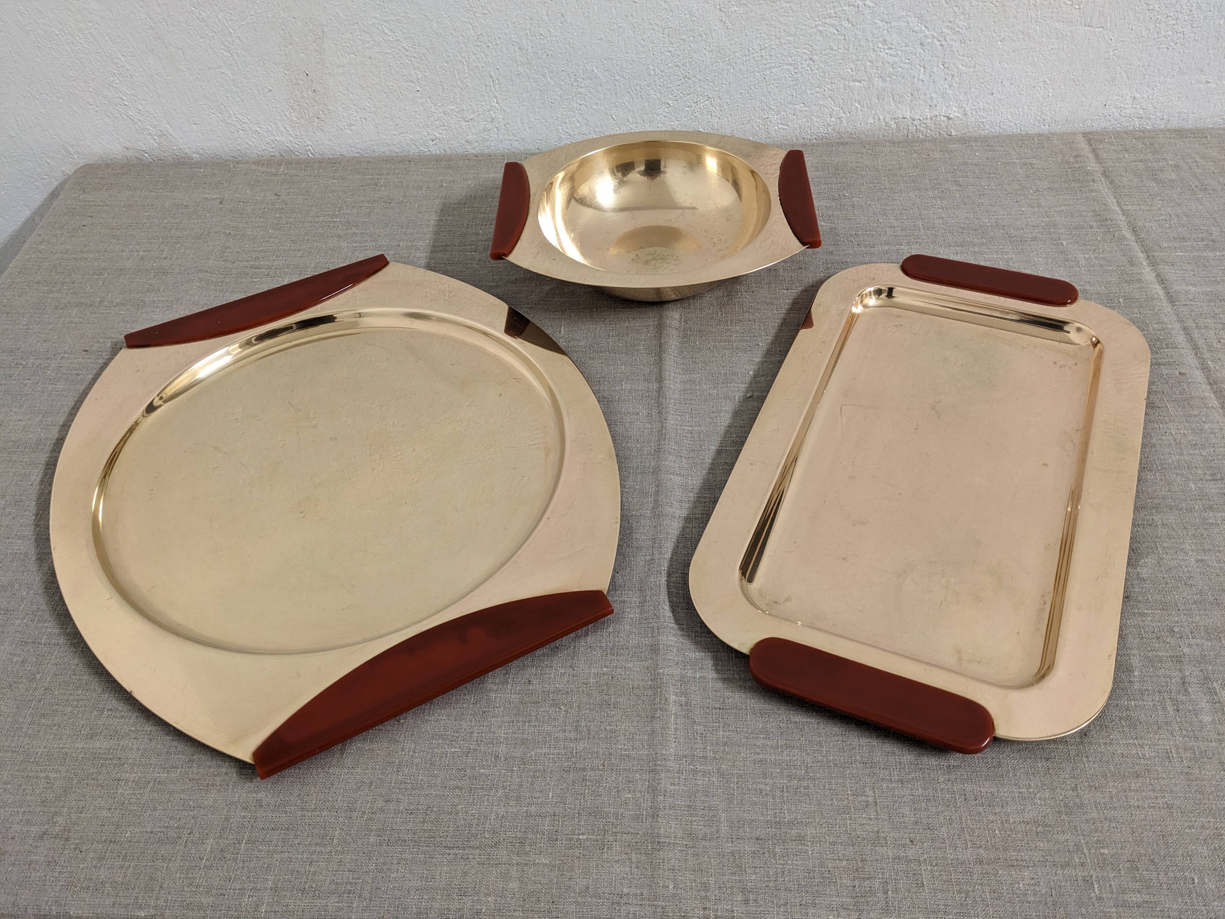 Plates and a brass and Bakelite cut by PM Italy, Italy around 1970.
