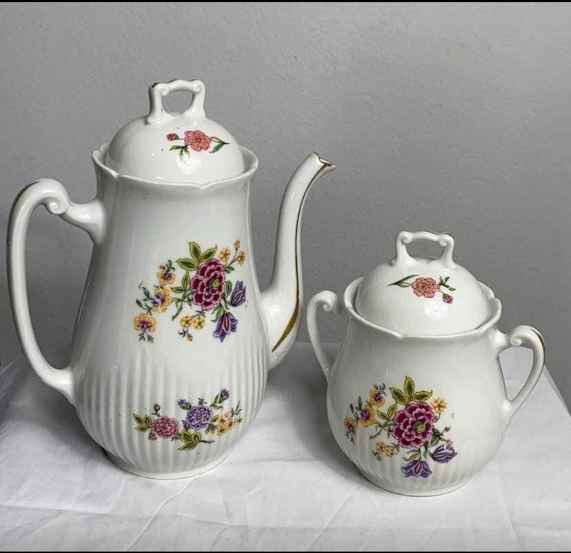 Antique porcelain teapot and sugar bowl