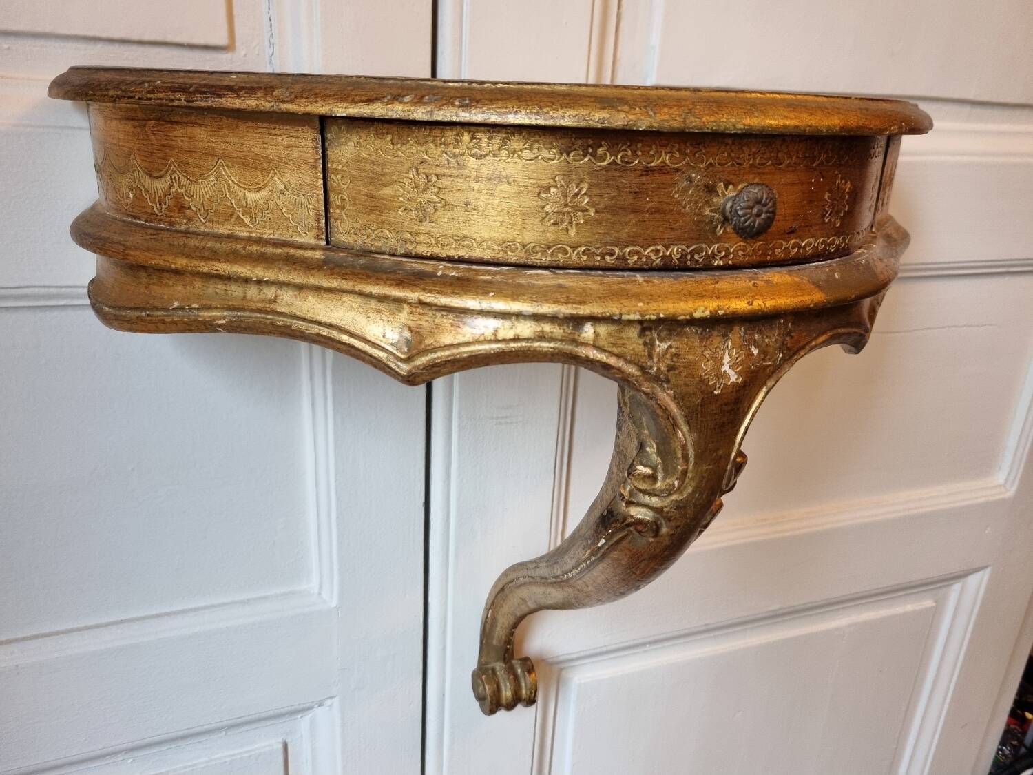 Mid-19th century wall console in wood and gilded stucco