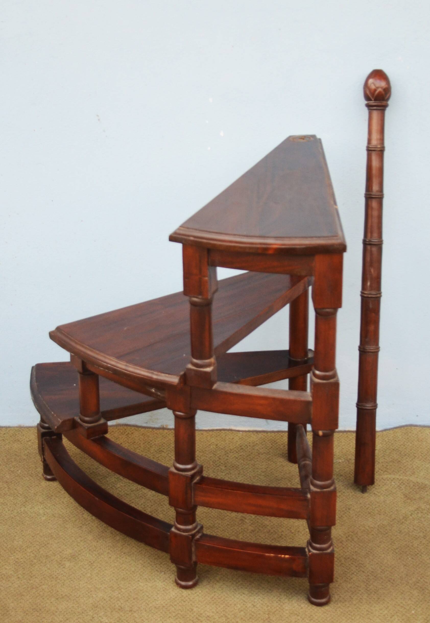 Spiral staircase for library made of mahogany wood