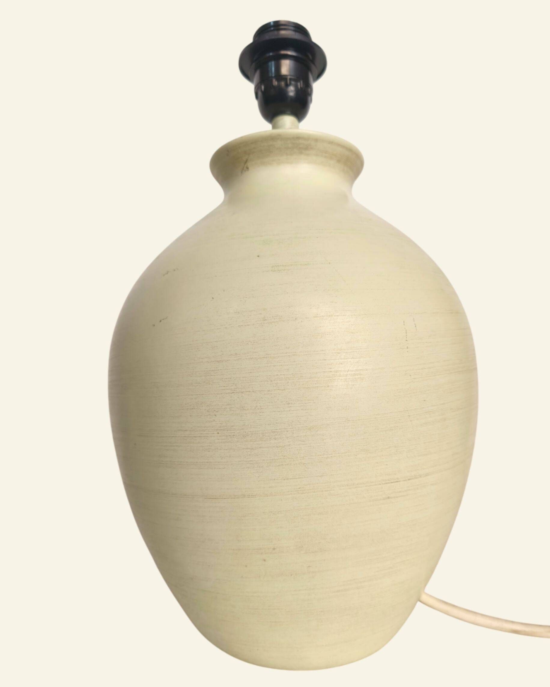 Ceramic lamp base turned in sand colour, organic shape.