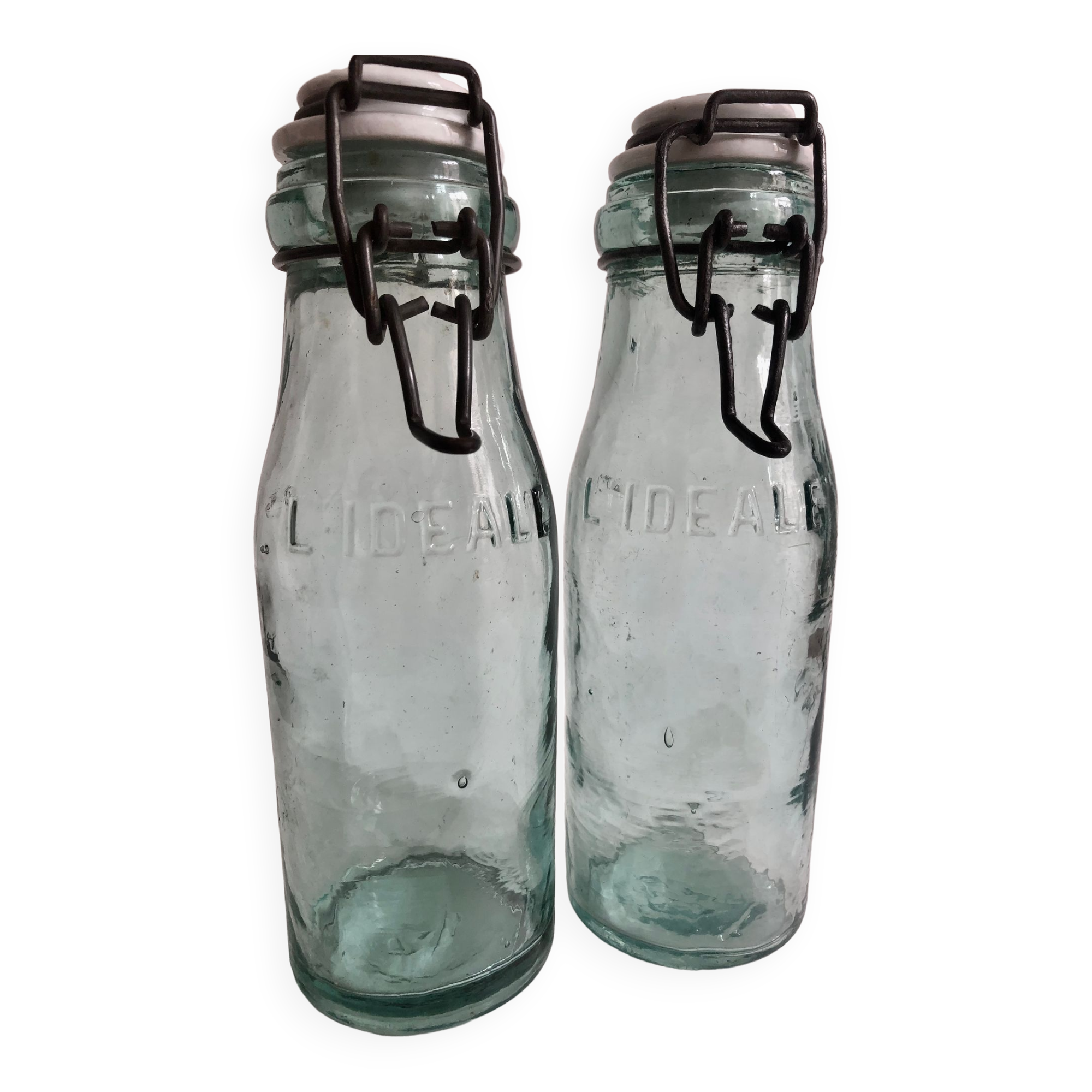 Two bottles with canned goods l'ideale