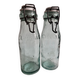 Two bottles with canned goods l'ideale