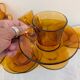 8 Duralex amber glass cups and saucers – France, 1970s