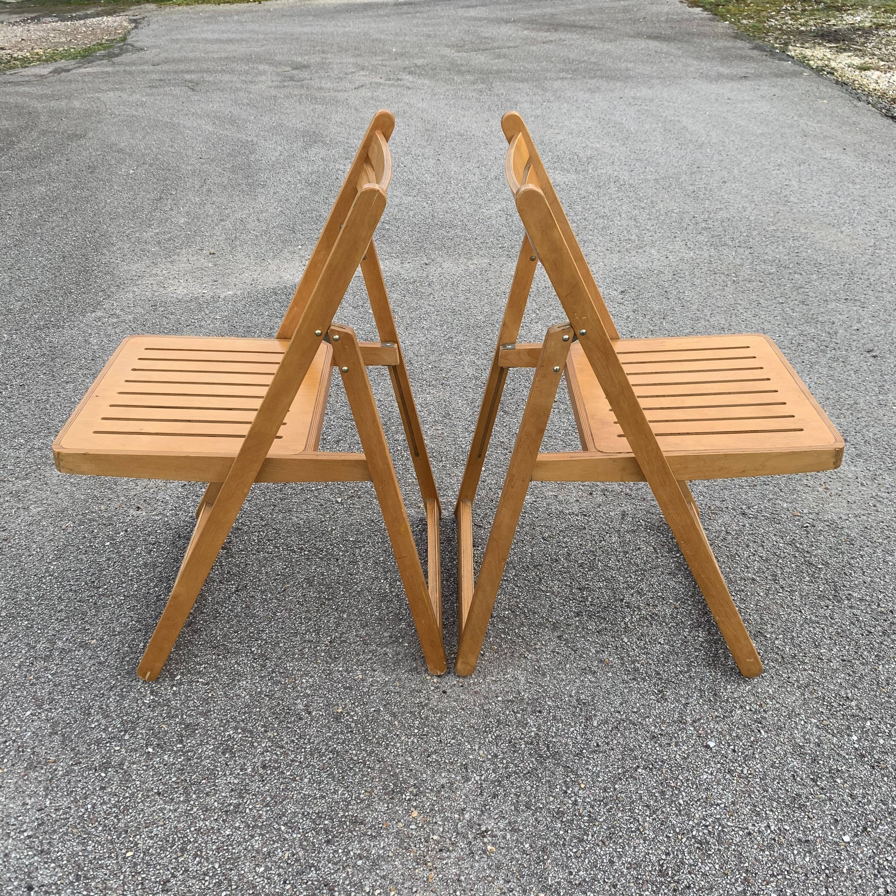 Pair of folding wooden chairs