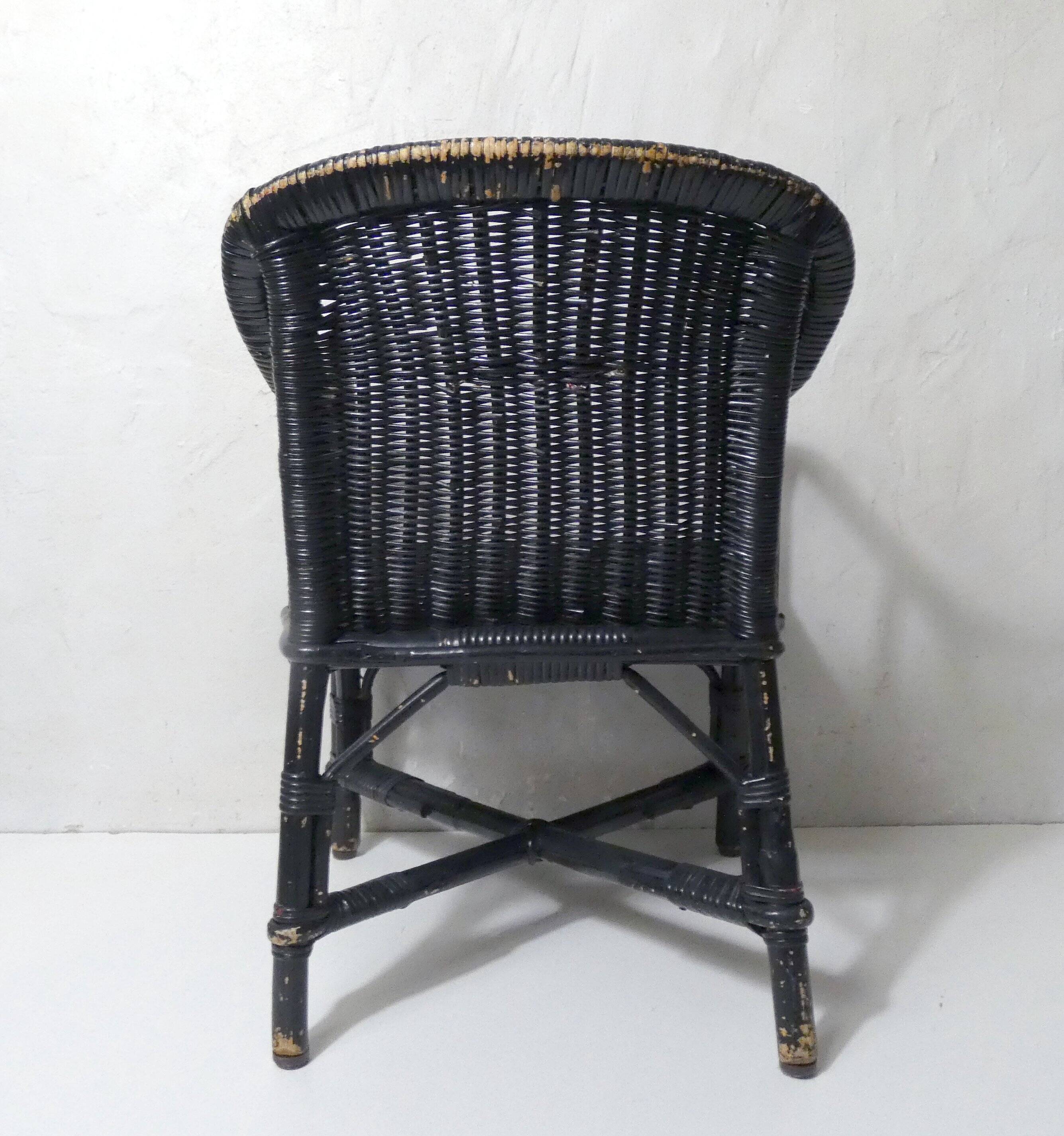 Vintage children's size rattan armchair