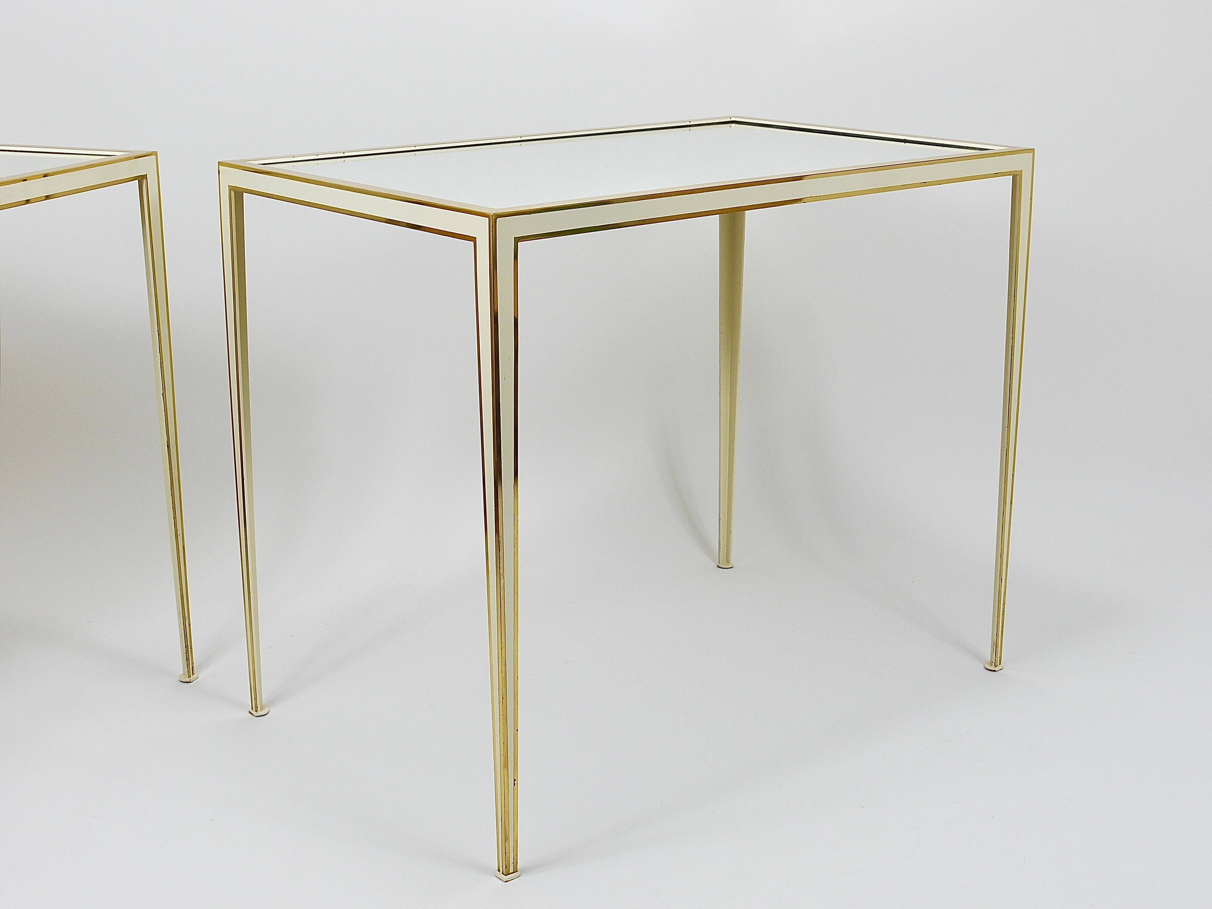 A pair of brass and white mirror tables from Vereinigte Werkstätten, Germany, 1970s.