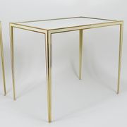 A pair of brass and white mirror tables from Vereinigte Werkstätten, Germany, 1970s.