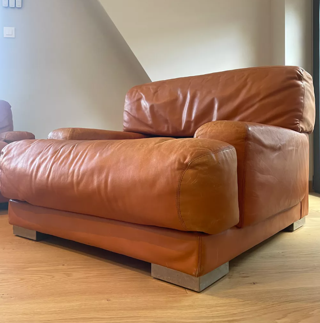 Pair of vintage armchairs Gérard Guermonprez tawny leather and stainless steel, France 1970