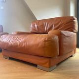 Pair of vintage armchairs Gérard Guermonprez tawny leather and stainless steel, France 1970