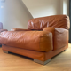 Paire de fauteuils vintage Gérard Guermonprez cuir fauve et inox, France 1970