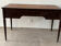 Empire style desk in mahogany and gilded leather