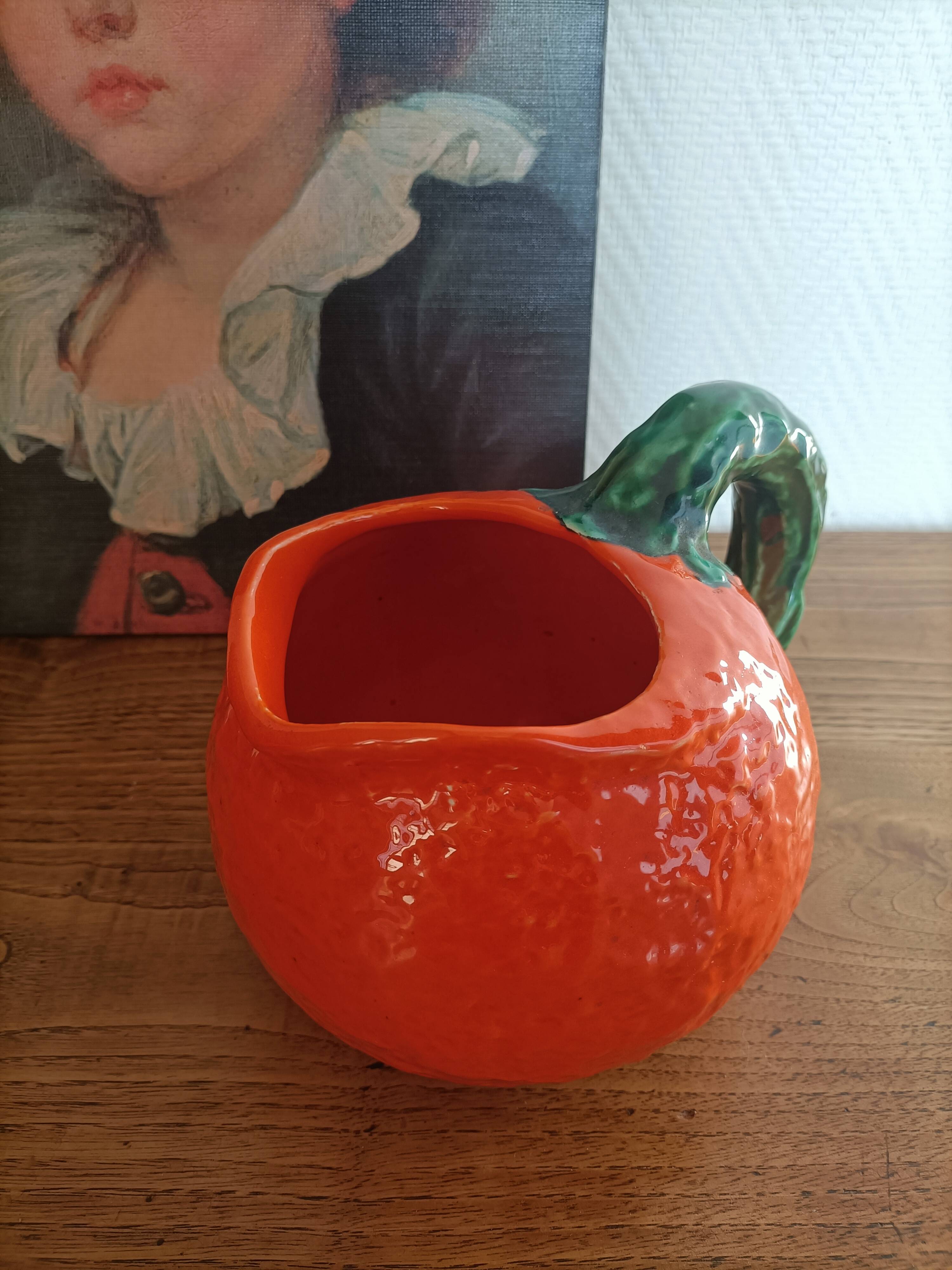 Orange pitcher in Corsican slip