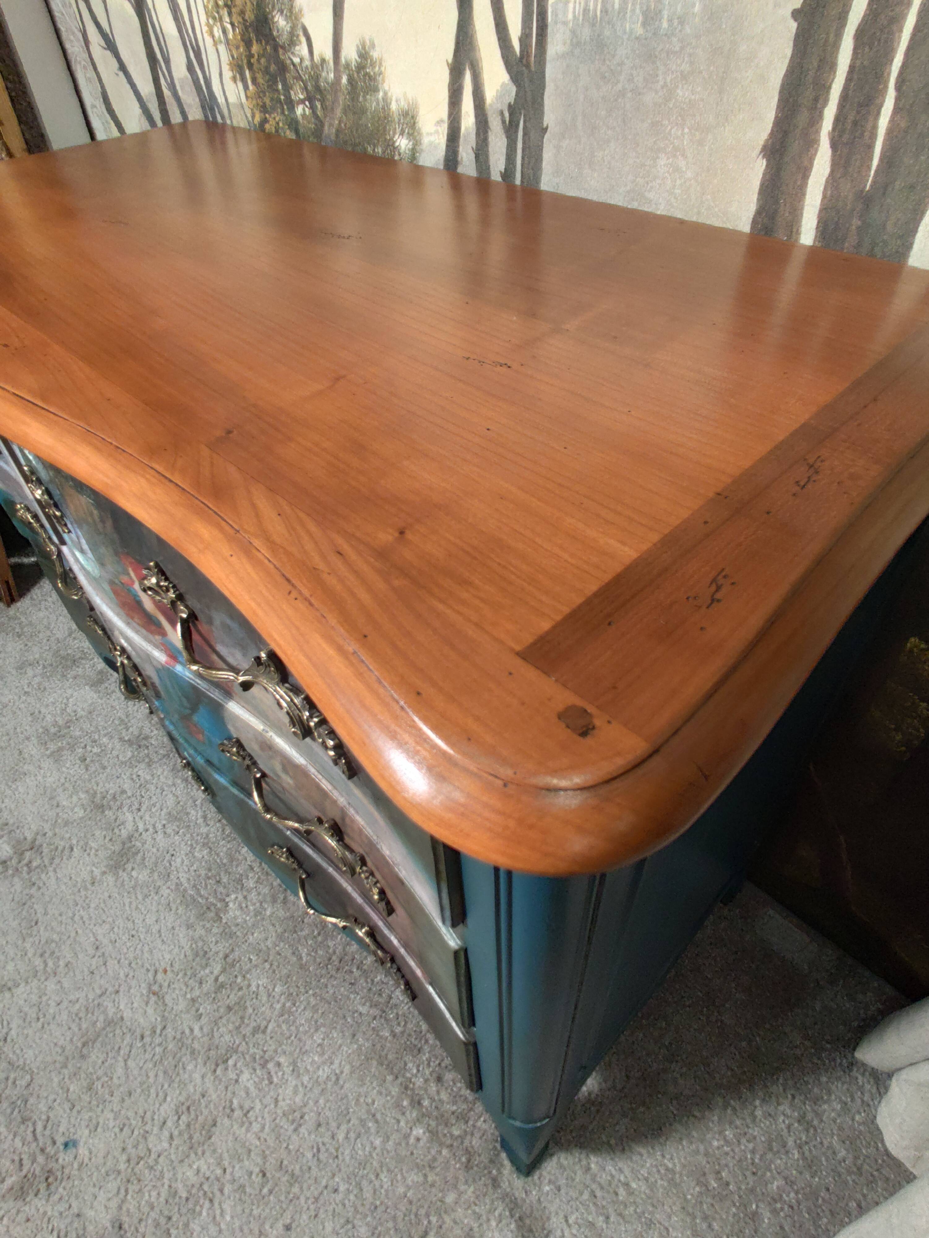 Patinated crossbow chest of drawers