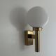 Large minimalist cinema wall light in opal glass and heavy brass, 1960s, Germany