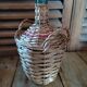 Dame Jeanne Bonbonne Bottle Touque bluish glass wicker Dp 1122414
