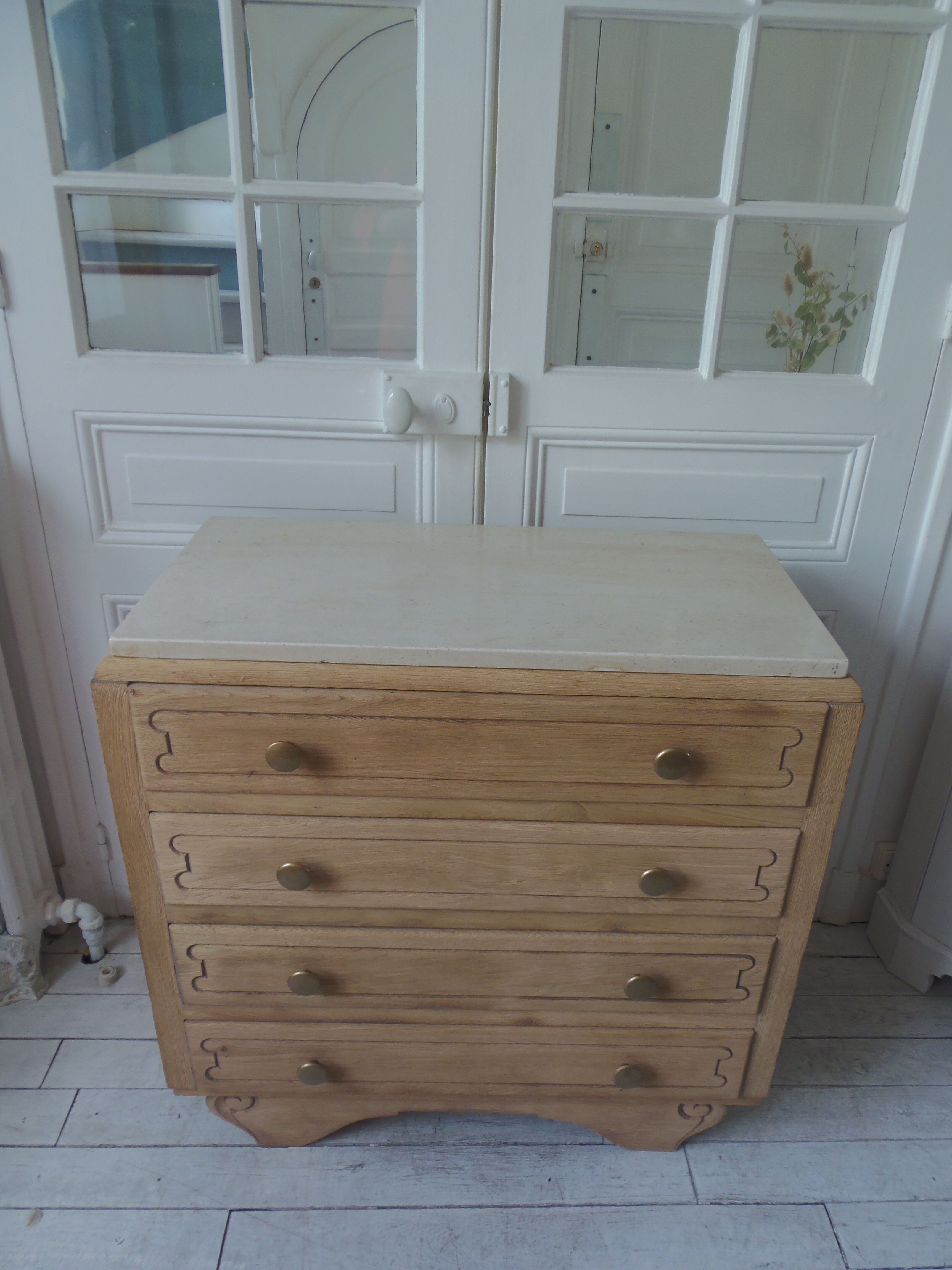 Vintage oak chest of drawers, a travertine plate laid for tray.