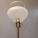 Table lamp with gold metal base and vintage white glass lampshade