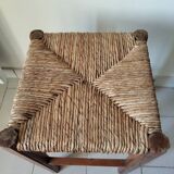 Antique campaign stool in solid wood with a straw seat.