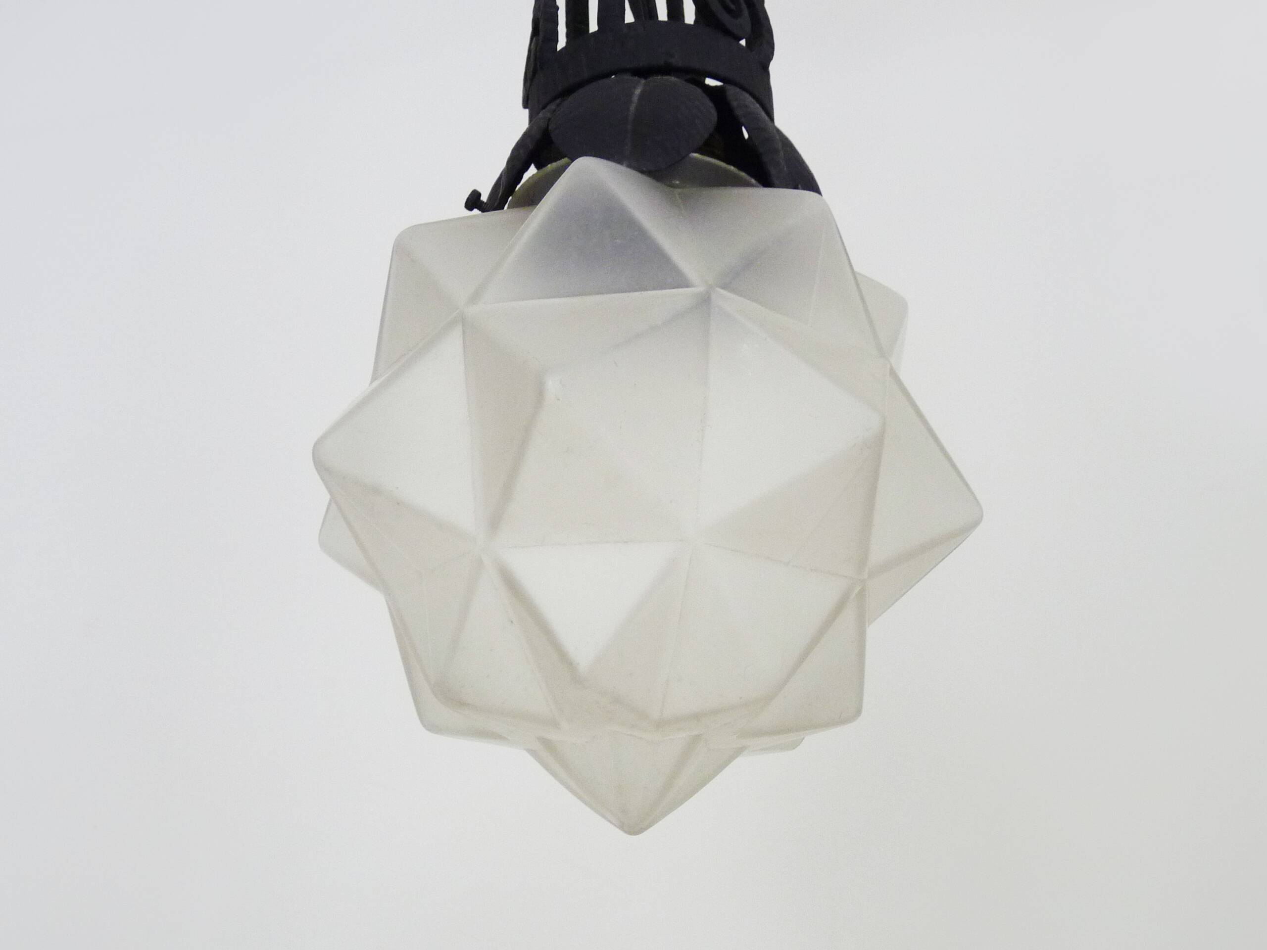 Chandelier, Art Deco suspension in wrought iron and star globe in glass paste.