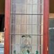 Late 19th century store doors, haberdashery front with Art Nouveau stained glass windows