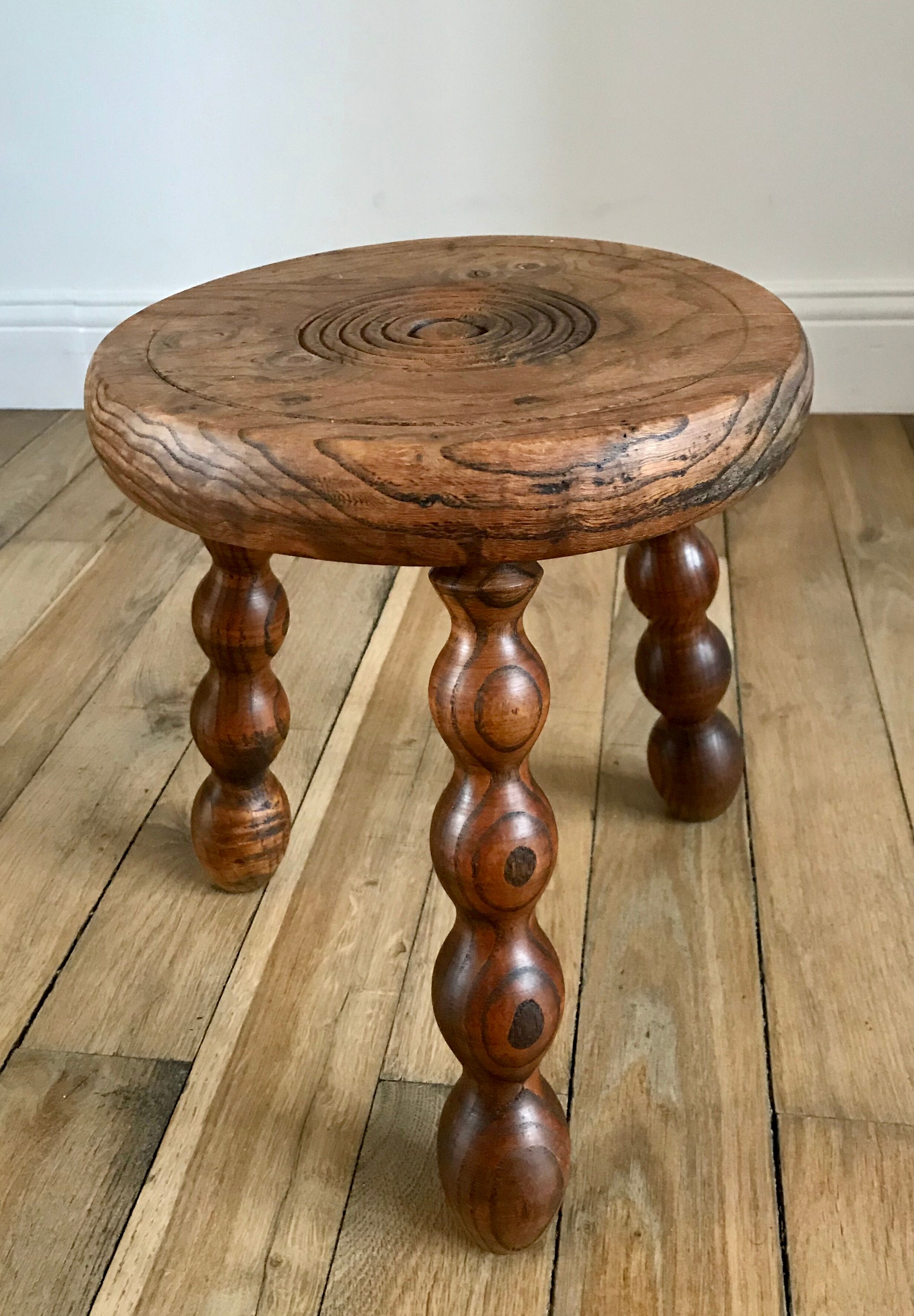 Low wooden stool turned solid 70s