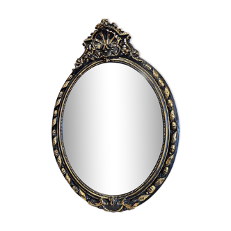Ancien miroir ovale patiné noir et doré style louis xv
