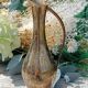 Carafe vase in chiseled brass