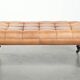 Sheepskin ottoman/coffee table on wheels in English chesterfield style