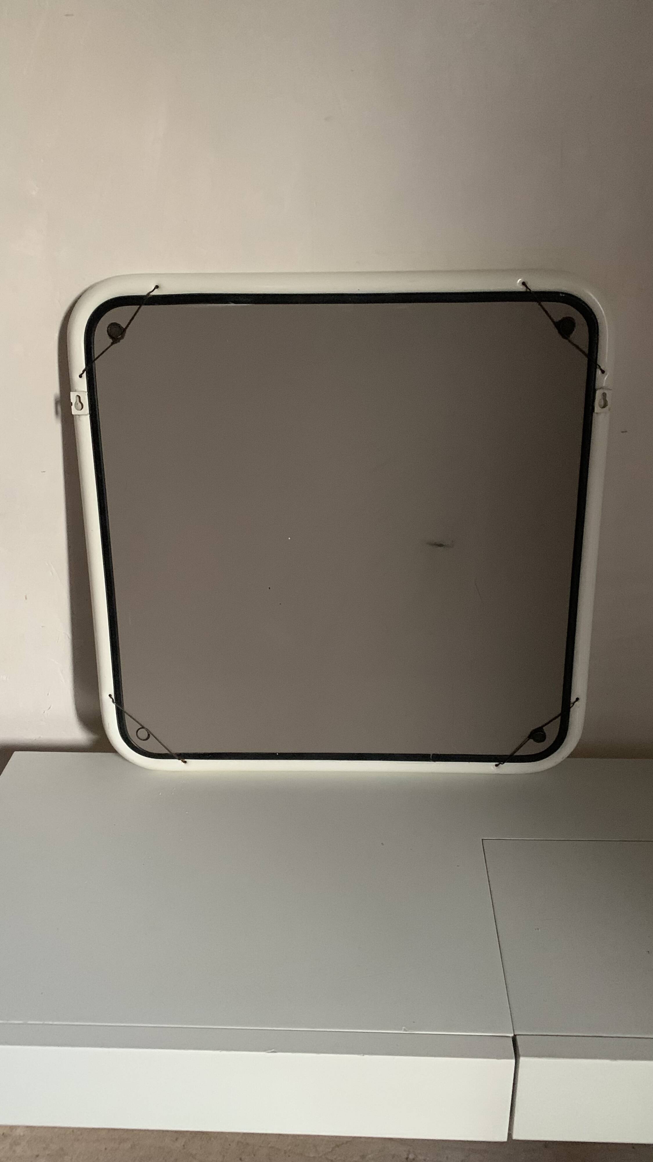 White tubular metal wall mirror