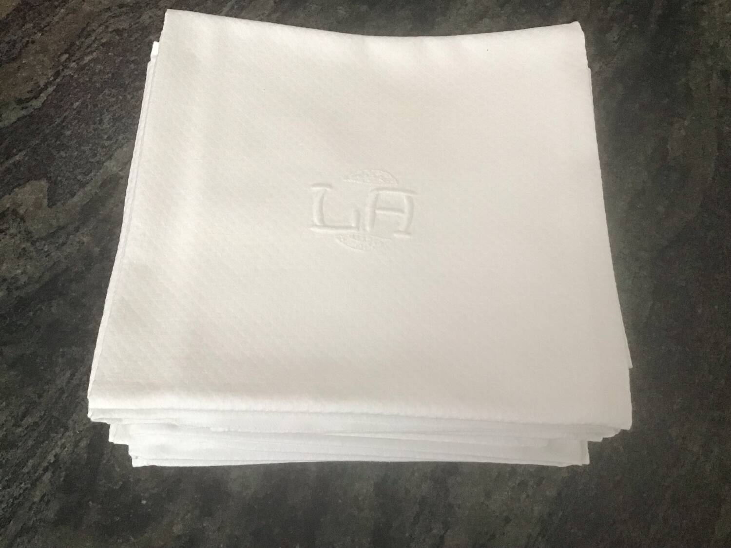 12 white damask napkins with LA monogram