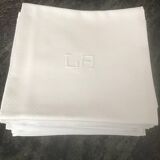 12 white damask napkins with LA monogram