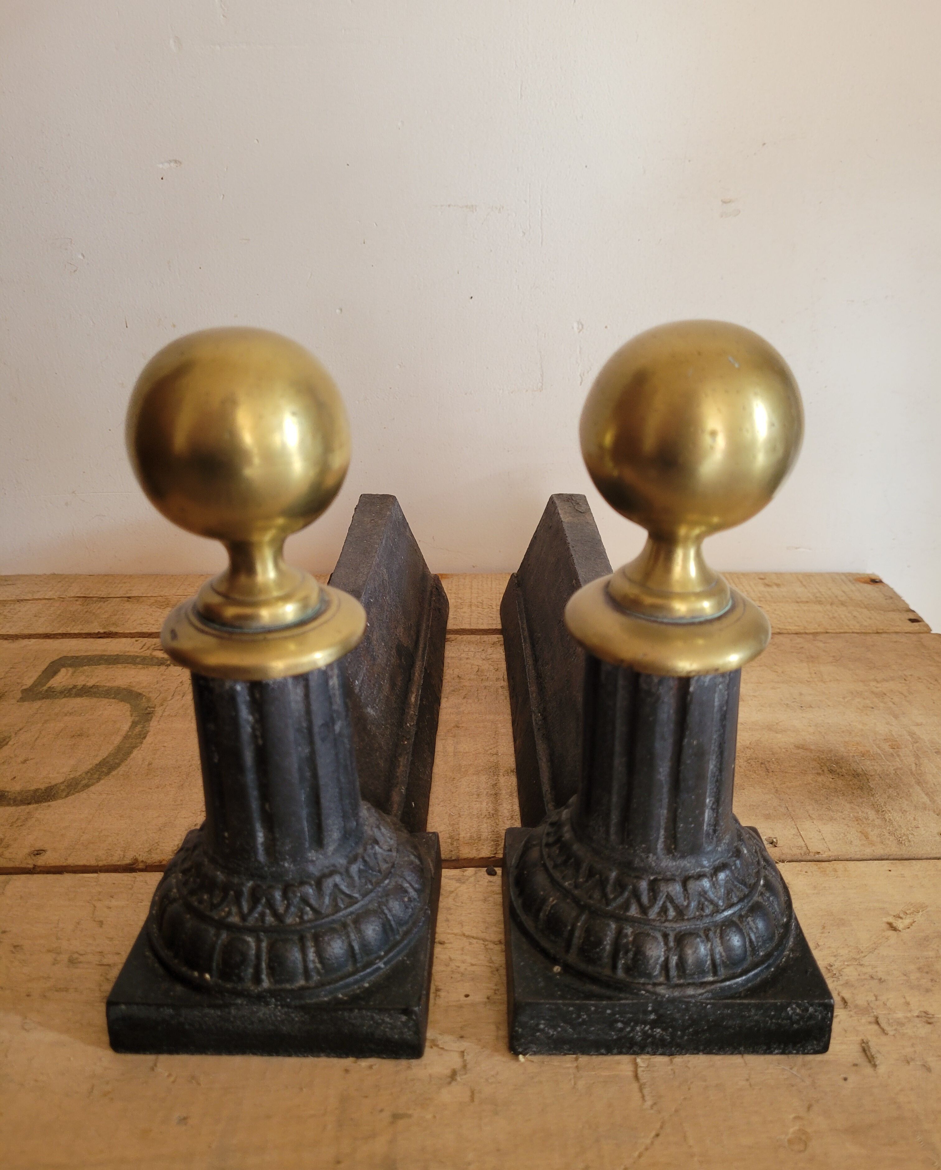 Pair of cast iron and brass chenets