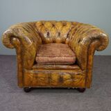 Patinated Chesterfield armchair