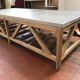 Coffee table in natural oak and top in blue stone of Flamant