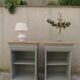 2 Louis Philippe style bedside tables reimagined in grey-green, wooden top.