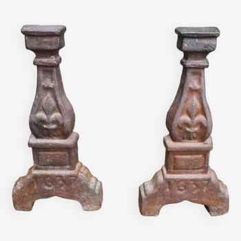 Pair of cast iron andirons dated 1637