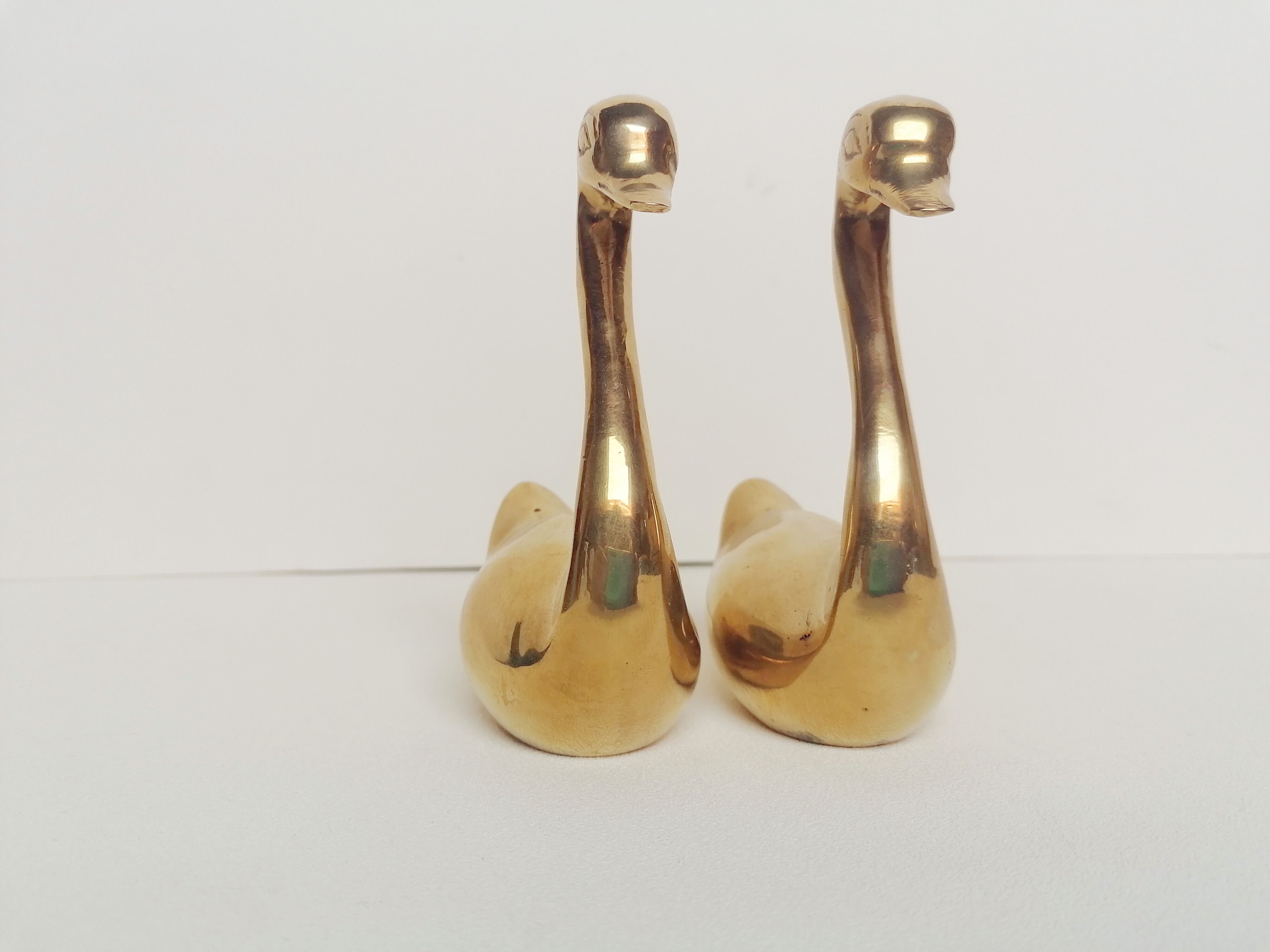 Two ducks made of solid brass