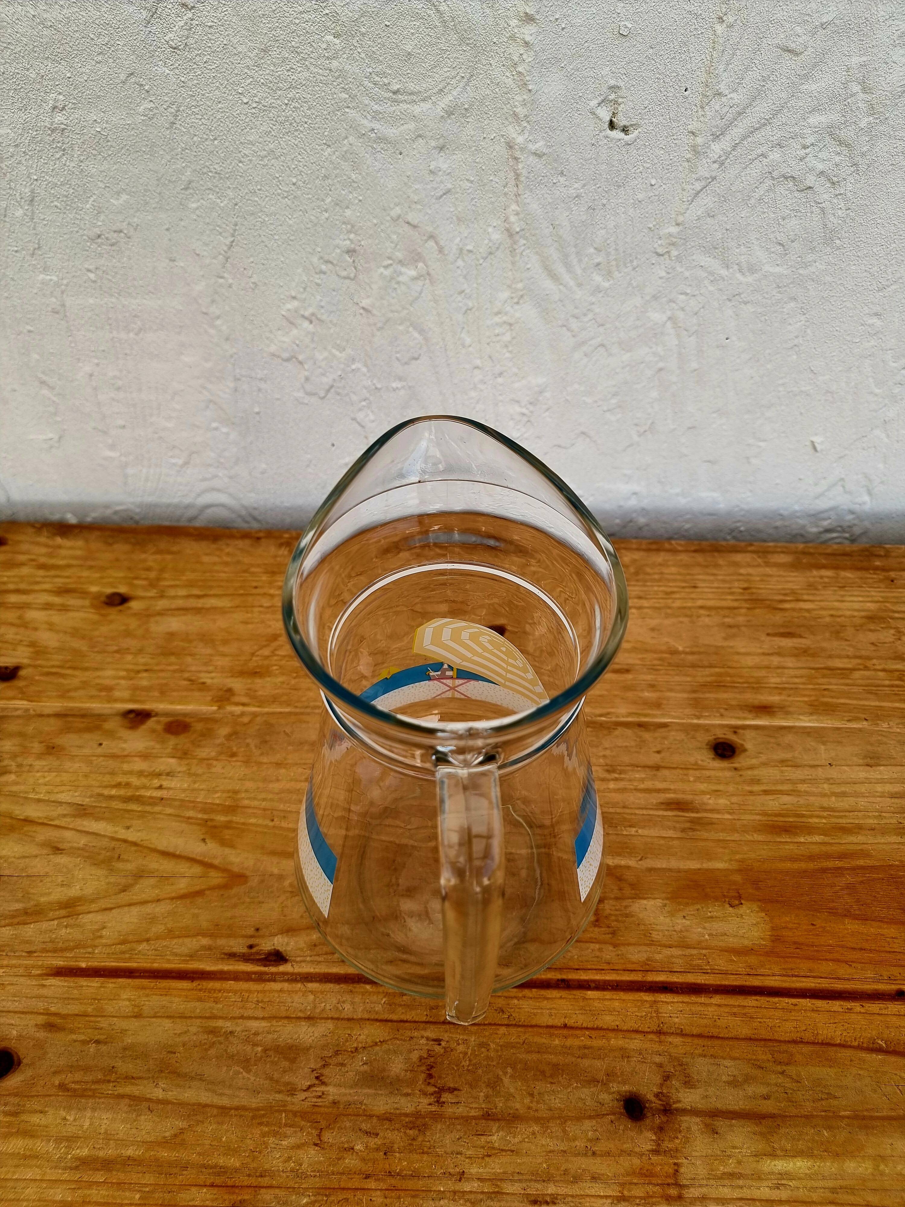 Vintage glass pitcher with summer decor