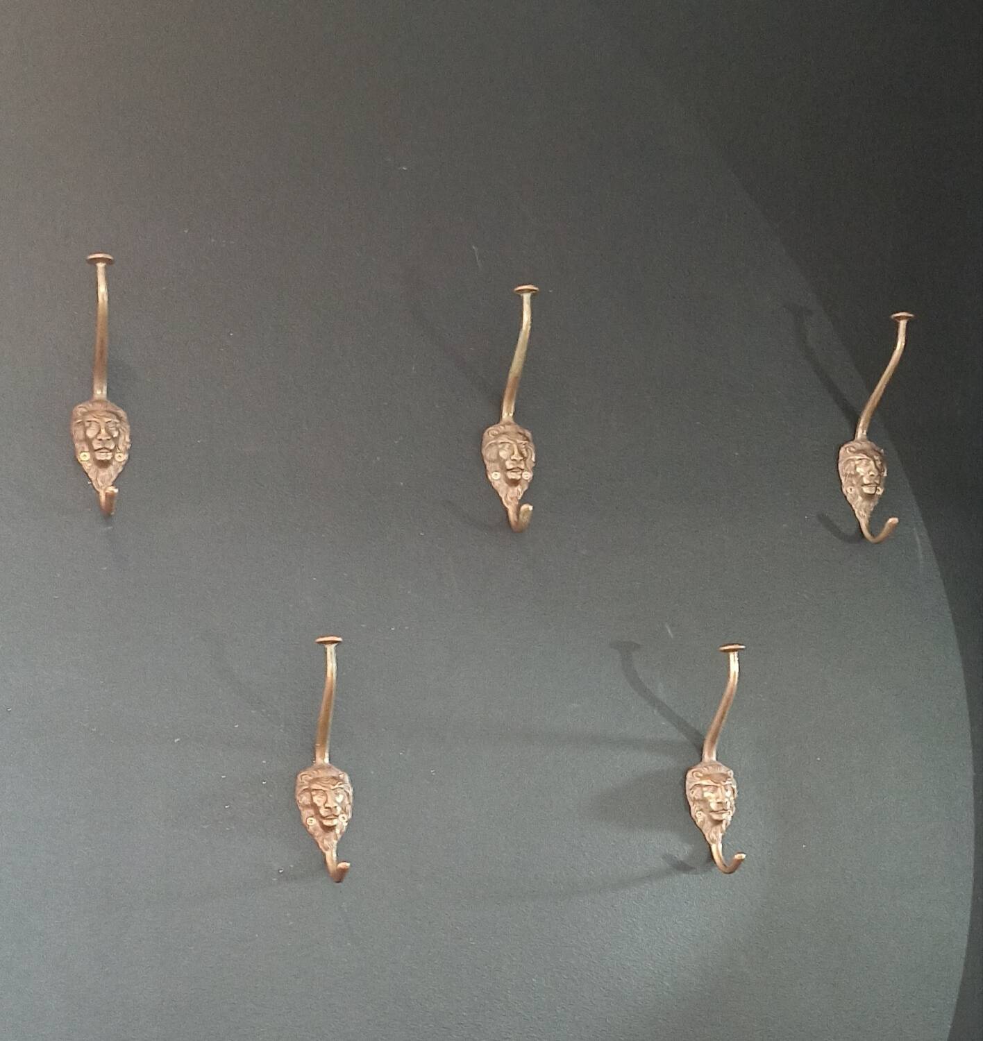 Set of 5 antique "Lion Head" coat hooks.