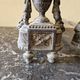 Pair of bronze andirons in Louis XVI style, late 19th century.