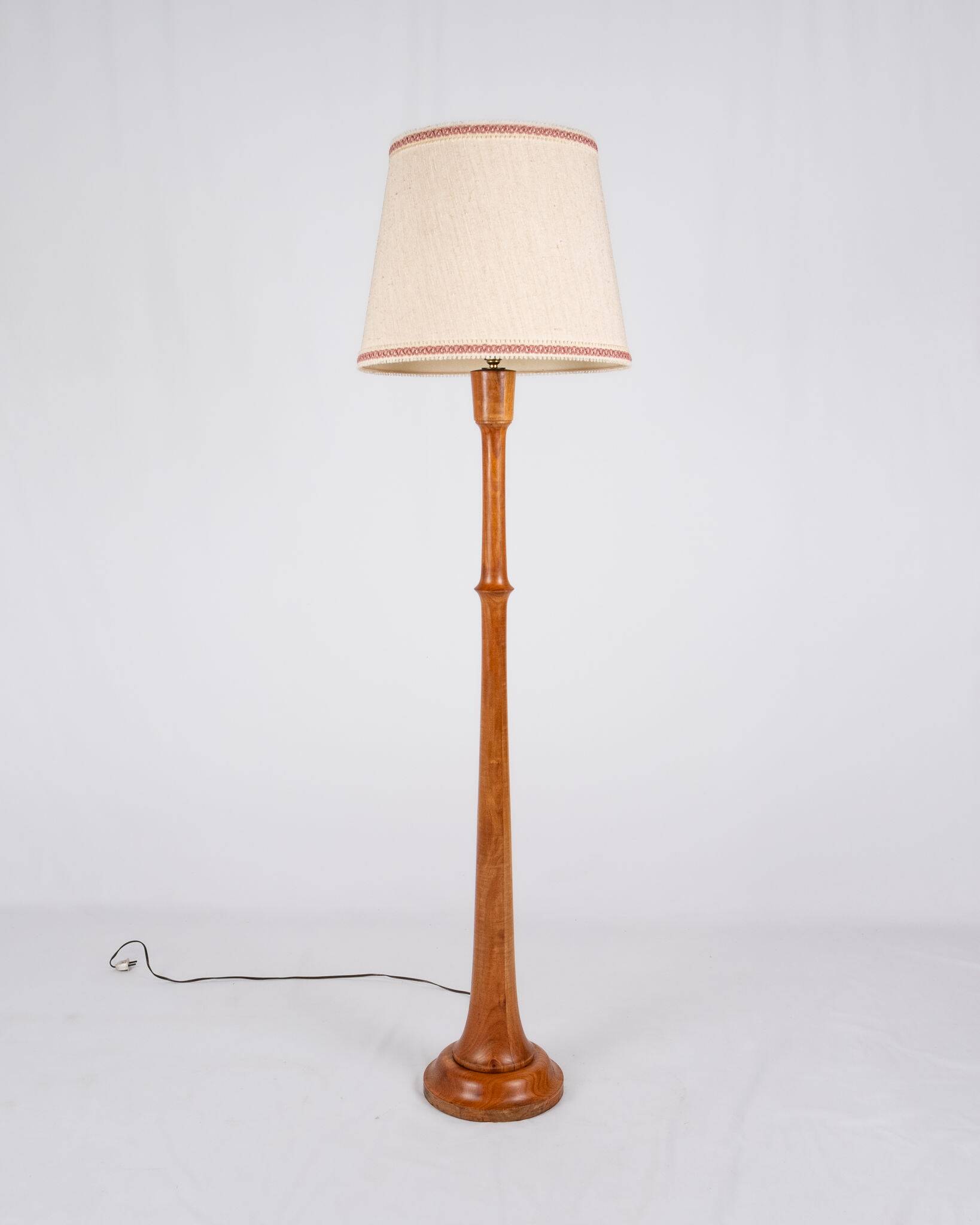 Pair of turned wooden floor lamps in Art Deco style, France, mid-20th century.