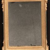 Louis XVI style mirror in gilded wood