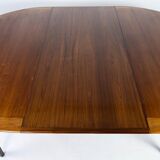 Dining table in rosewood with two extension plates, of danish design from the 1960s.