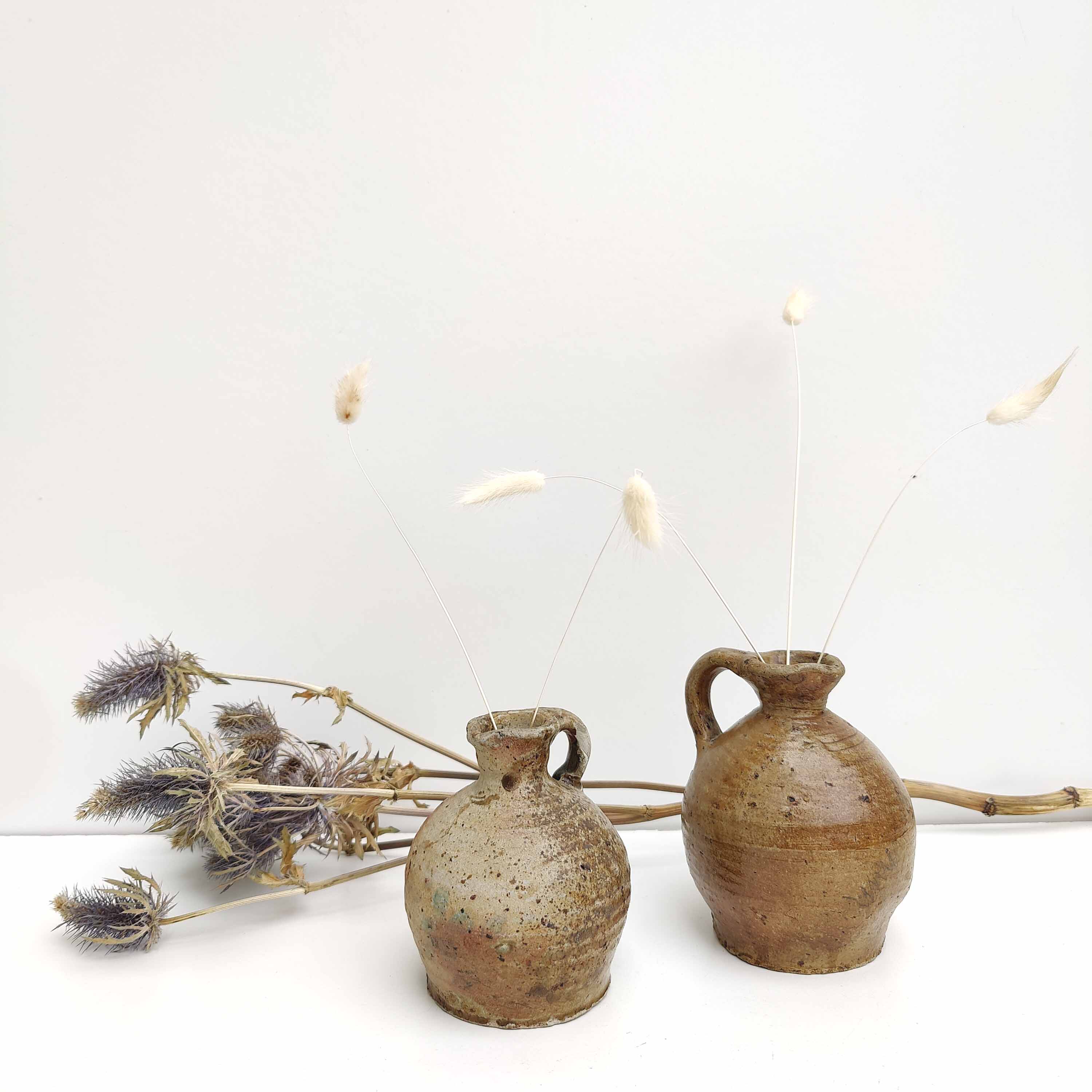 Set of two small sandstone pitchers