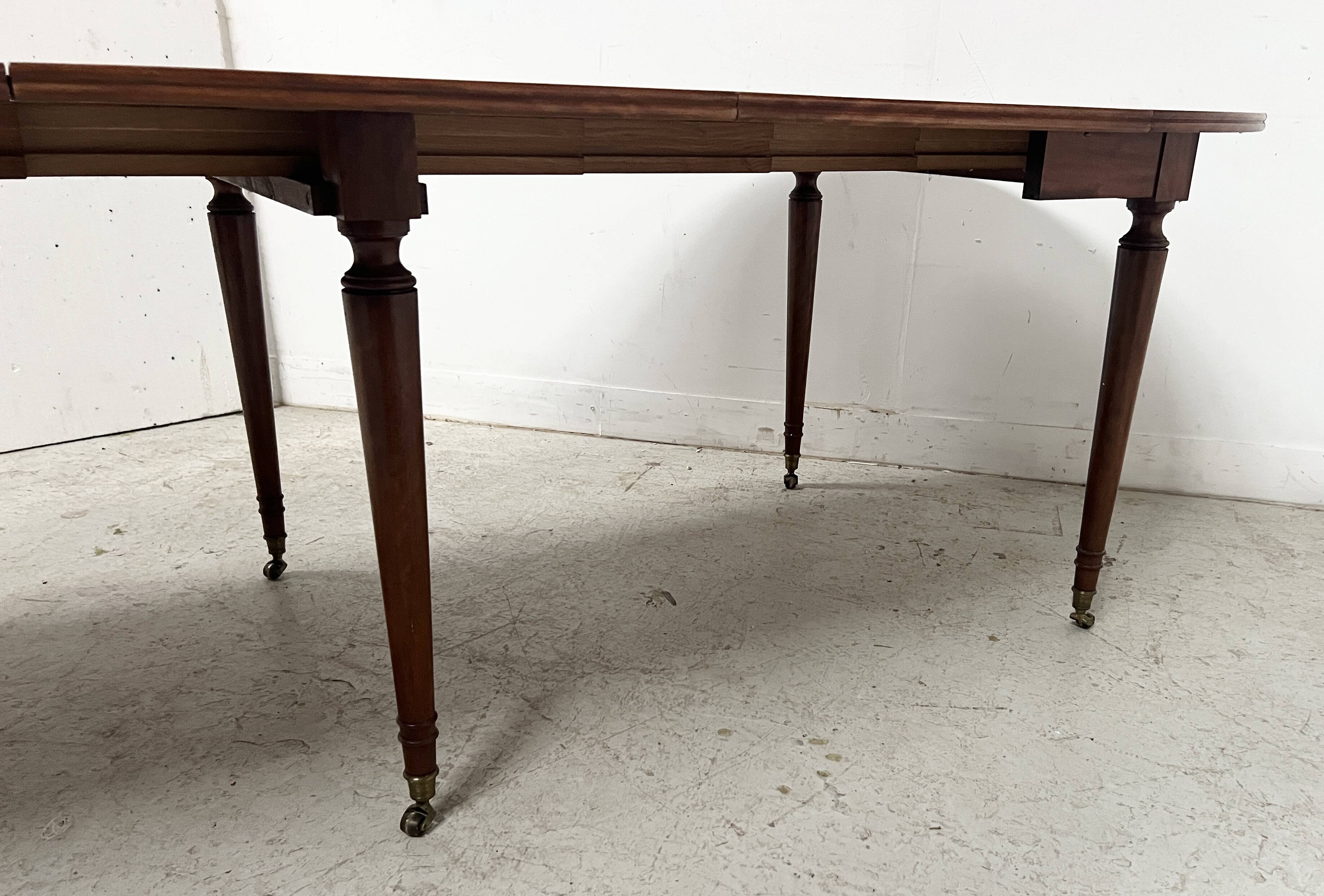 A six-foot Louis XVI style mahogany table from the 19th century.
