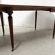 A six-foot Louis XVI style mahogany table from the 19th century.